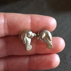 Manatee stud earrings.